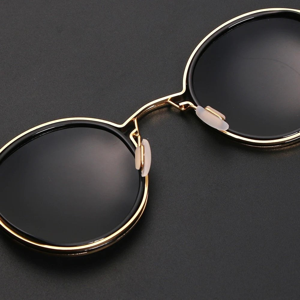 Leticia · Gafas de sol redondas con patillas doradas